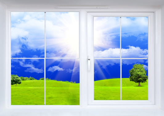 Summer landscape seen from the closed window