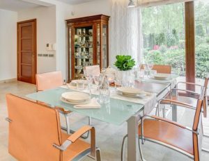 Glass table and modern chairs in the dining room